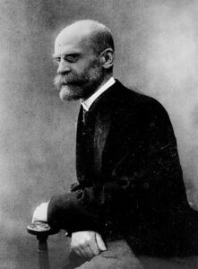 Émile_Durkheim sitting in chair.